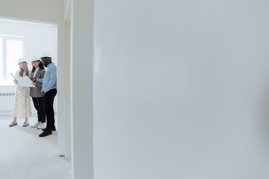 General contractor reviewing project plans at a house