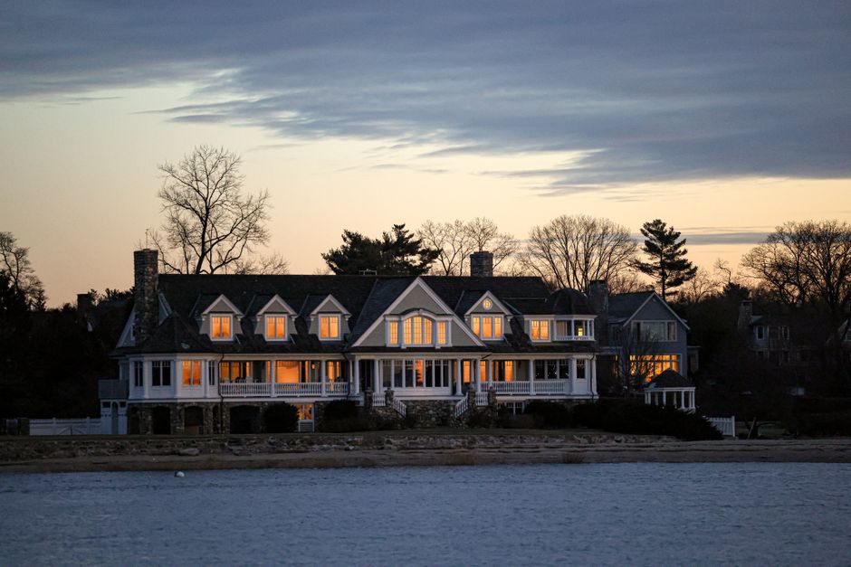 Large custom home exterior in the evening